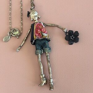 SERVANE GAXOTTE Charm Doll Pendant Necklace with Floral Top